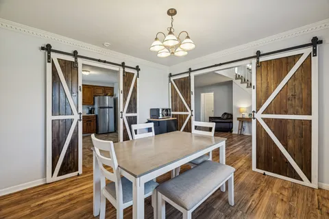 a view of a livingroom with furniture and wooden floor