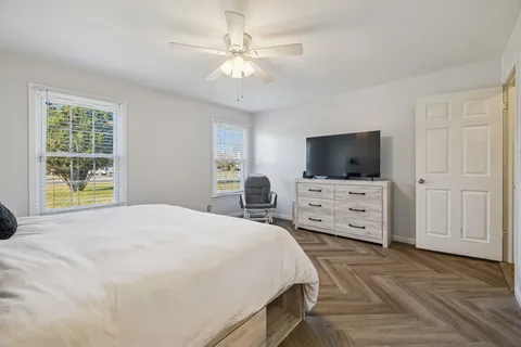 a spacious bathroom with a granite countertop sink mirror and double