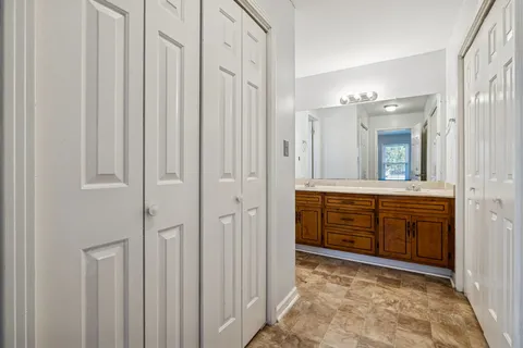 a bathroom with a shower curtain and a toilet
