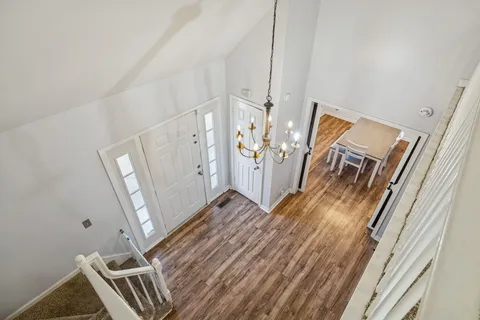 a bedroom with a bed and a ceiling fan