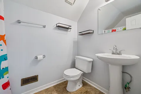 a view of a chair and table in the balcony