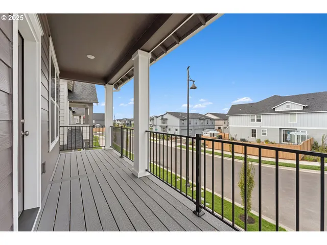 a view of balcony with wooden floor