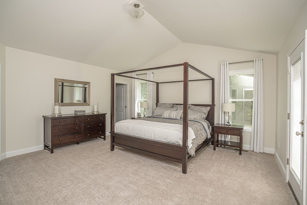 33 Clapp Road Rochester, MA 02770 - Photo 16 of 19 a bed room with a bed and a lamp