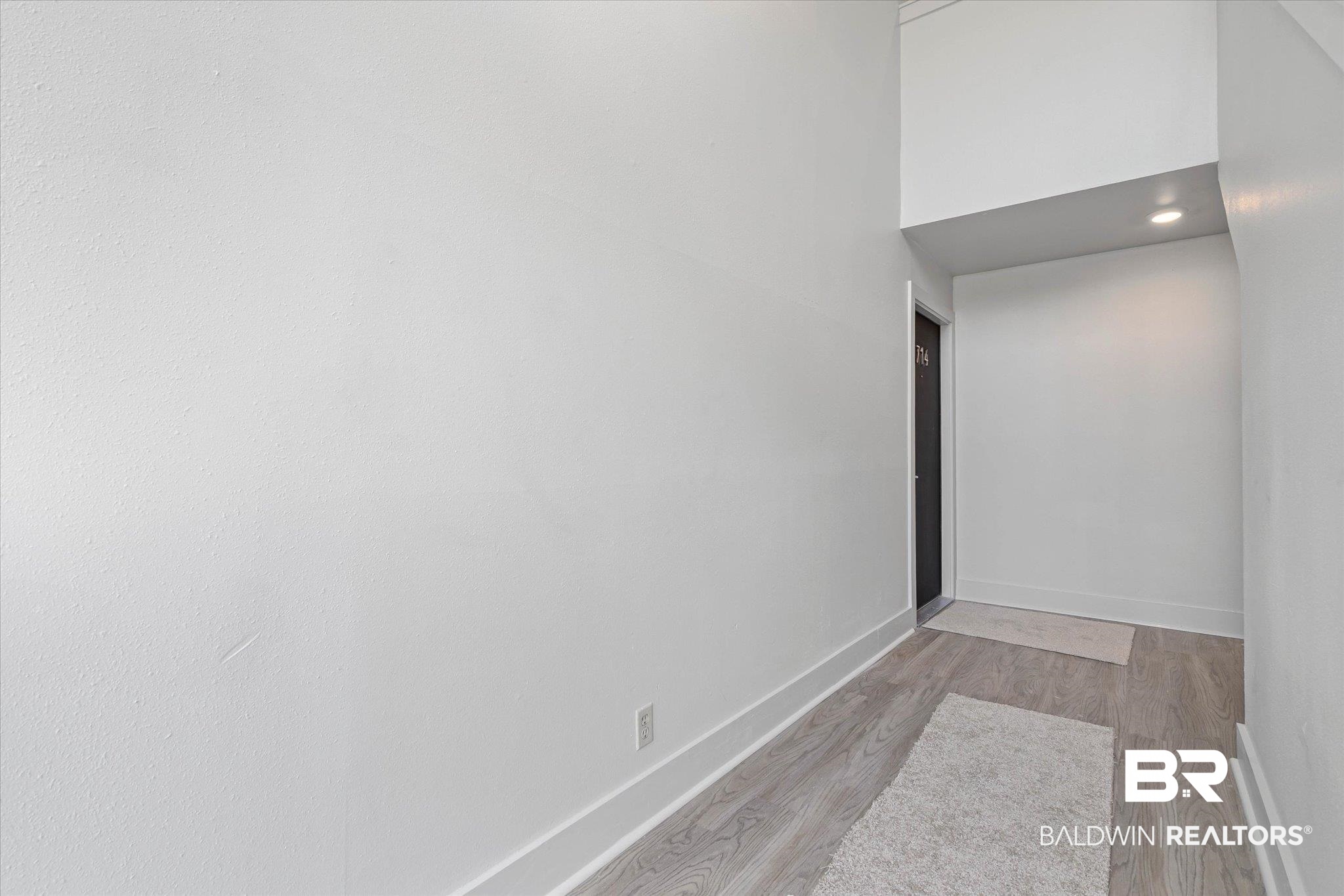 3655 Old Shell Road, Unit 712 Mobile, AL 36608 - Photo 2 of 19 Unfurnished room with light wood-style flooring and recessed lighting