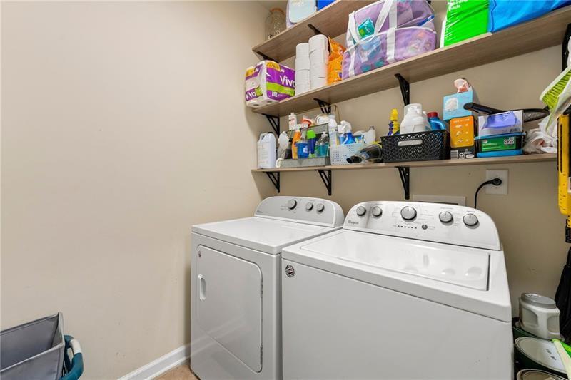 4970 Creekside Lane Powder Springs, GA 30127 - Photo 17 of 45 a utility room with dryer and washer
