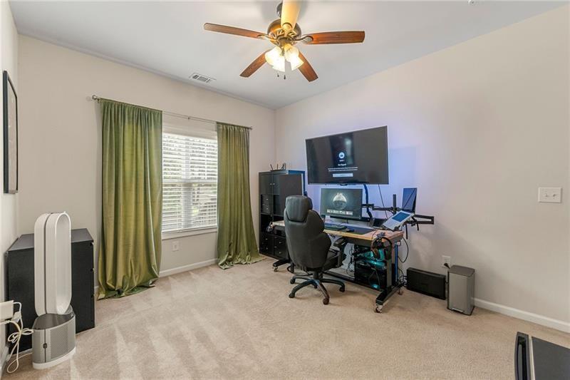 4970 Creekside Lane Powder Springs, GA 30127 - Photo 19 of 45 a view of a workspace with furniture and a window