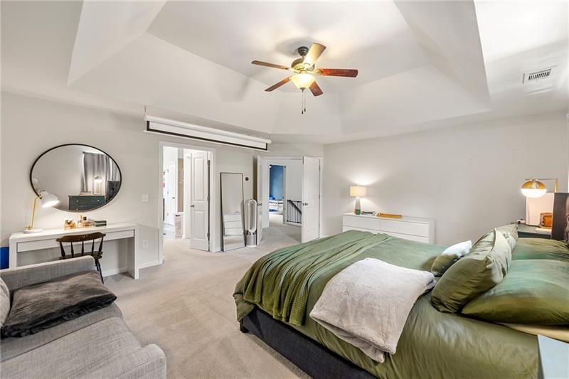 4970 Creekside Lane Powder Springs, GA 30127 - Photo 25 of 45 a bedroom with a bed a desk and chair
