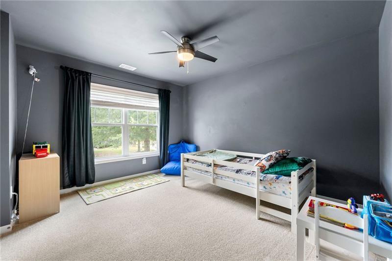 4970 Creekside Lane Powder Springs, GA 30127 - Photo 25 of 45 a bed room with a bed and a window