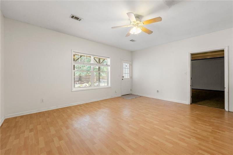 4970 Creekside Lane Powder Springs, GA 30127 - Photo 38 of 45 wooden floor in an empty room with a window