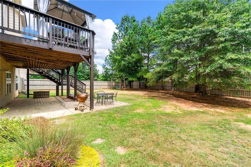 4970 Creekside Lane Powder Springs, GA 30127 - Photo 41 of 45 a view of a swimming pool with a patio