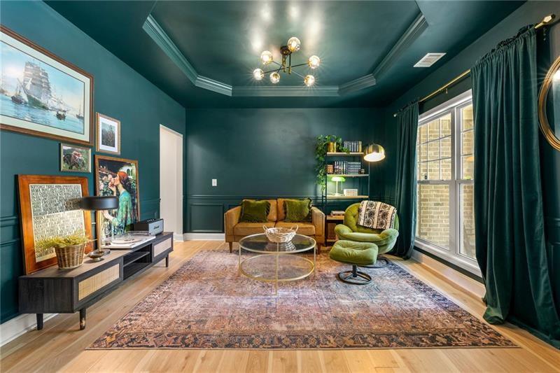 4970 Creekside Lane Powder Springs, GA 30127 - Photo 5 of 45 a living room with furniture and a flat screen tv