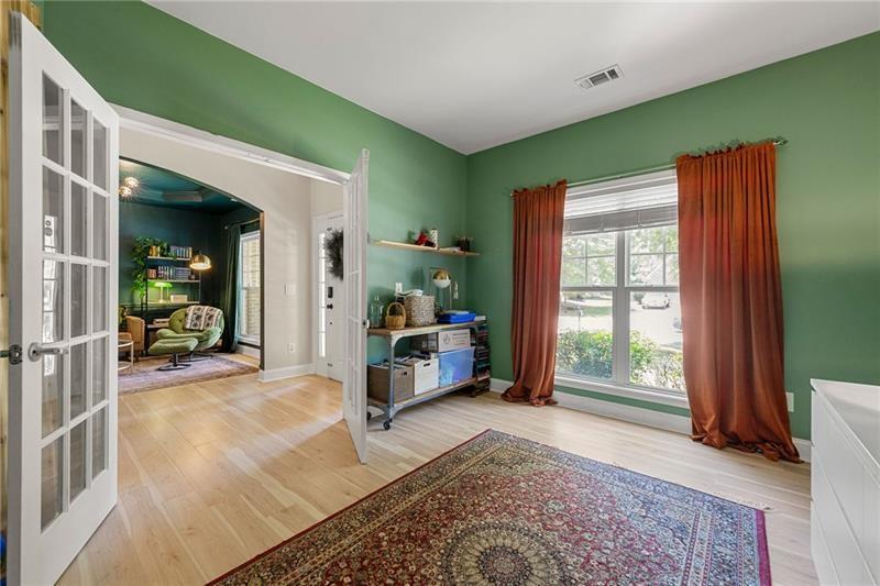 4970 Creekside Lane Powder Springs, GA 30127 - Photo 7 of 45 a living room with furniture a window and a flat screen tv