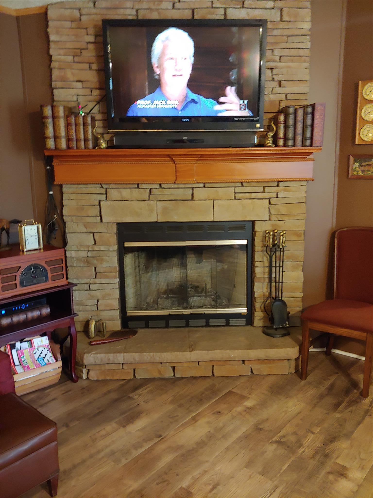 1235 Cunningham Road Readyville, TN 37149 - Photo 12 of 30 a fireplace with a clock on top of it