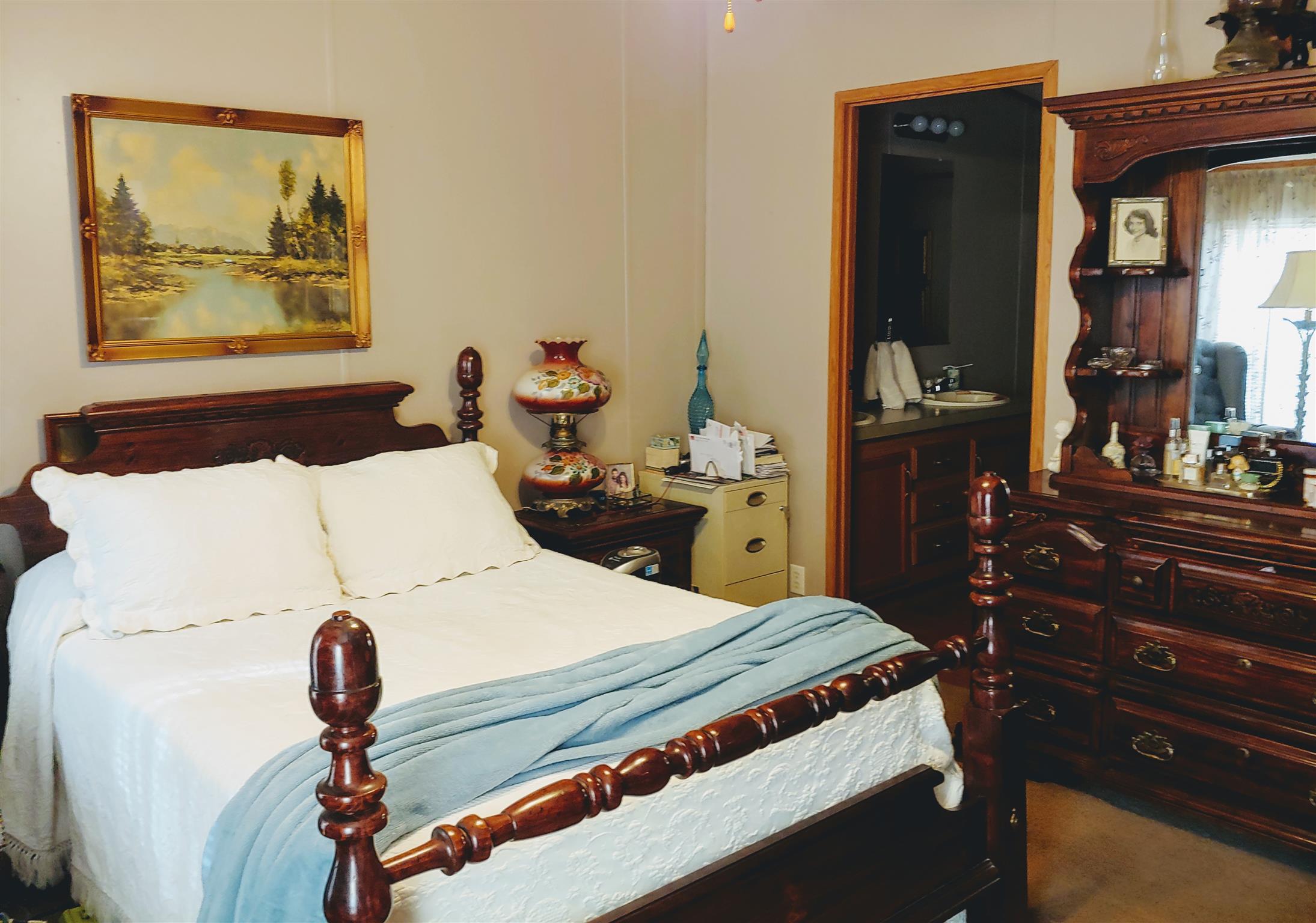 1235 Cunningham Road Readyville, TN 37149 - Photo 23 of 30 a bedroom with a bed and a chandelier
