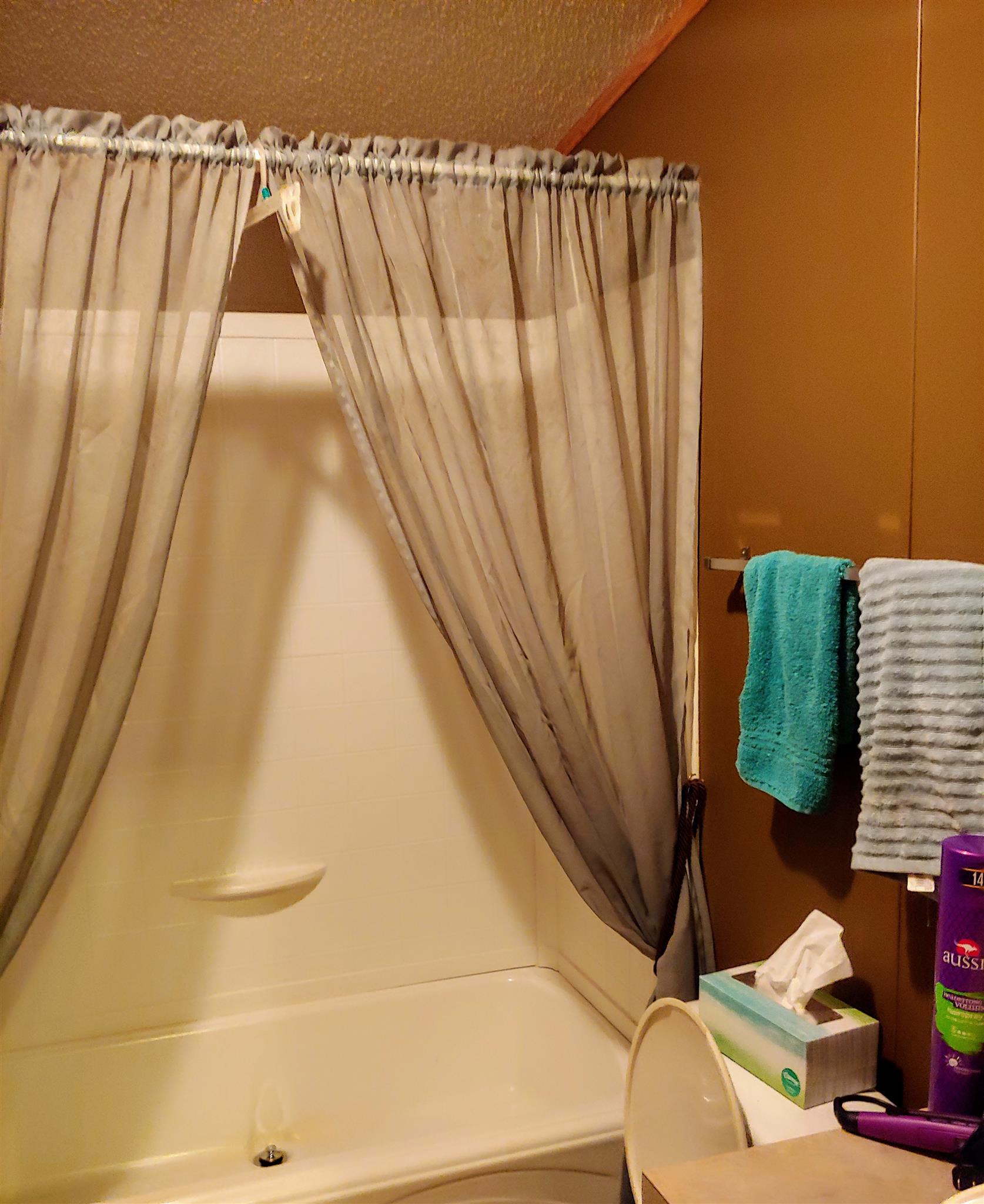 1235 Cunningham Road Readyville, TN 37149 - Photo 24 of 30 a bathroom with a sink and a shower curtain