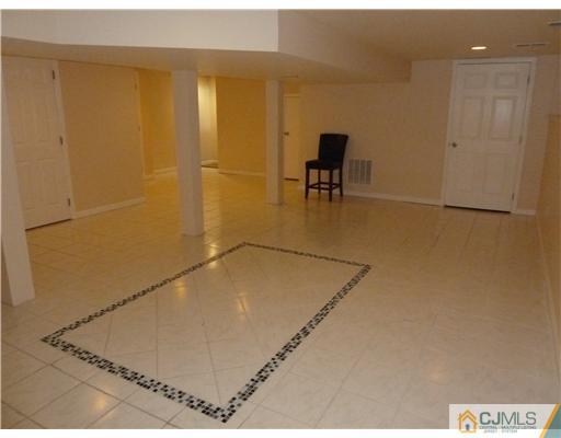 4 Paddock Court Edison, NJ 08820 - Photo 11 of 23 a view of a room with table and chairs