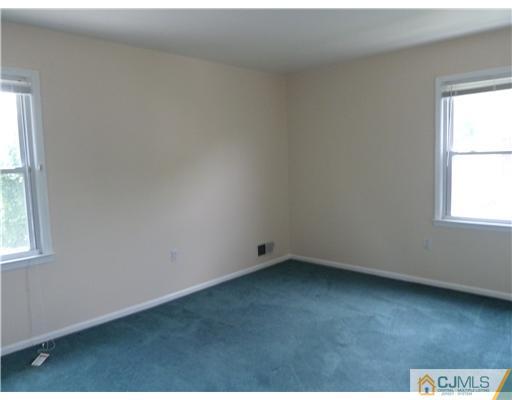4 Paddock Court Edison, NJ 08820 - Photo 19 of 23 an empty room with a window