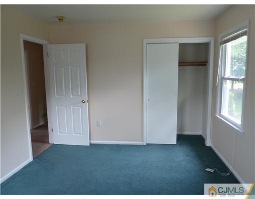4 Paddock Court Edison, NJ 08820 - Photo 20 of 23 a view of an empty room with a window