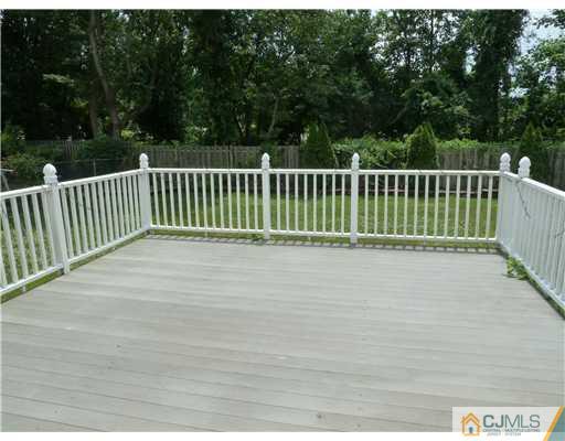 4 Paddock Court Edison, NJ 08820 - Photo 3 of 23 a view of a wooden fence