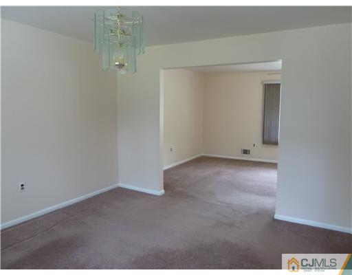 4 Paddock Court Edison, NJ 08820 - Photo 6 of 23 a view of an empty room