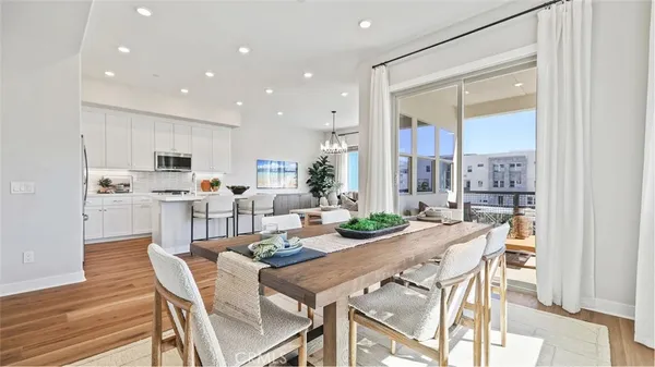 a view of a dining room kitchen and windows
