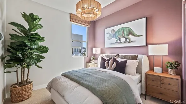 a bedroom with a bed and a couch