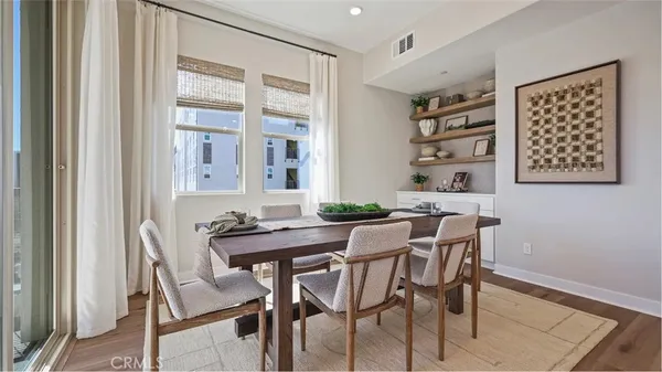 a view of a dining room with furniture and window