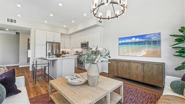 a kitchen with a table and chairs