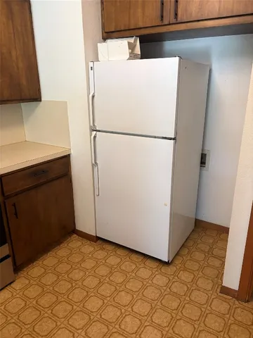 a kitchen with a stove and a cabinets