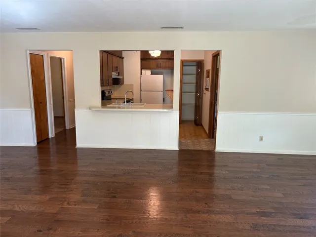 a view of kitchen with furniture and wooden floor