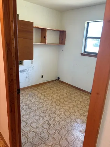 a kitchen with stainless steel appliances granite countertop a refrigerator a sink and a stove