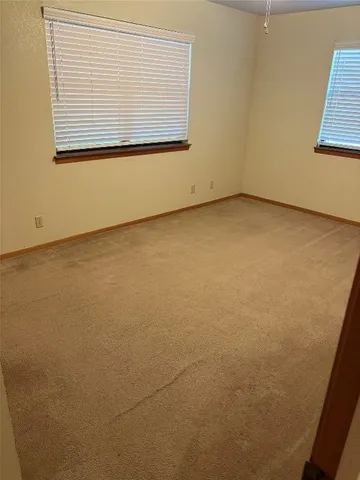 a bathroom with a sink toilet and mirror