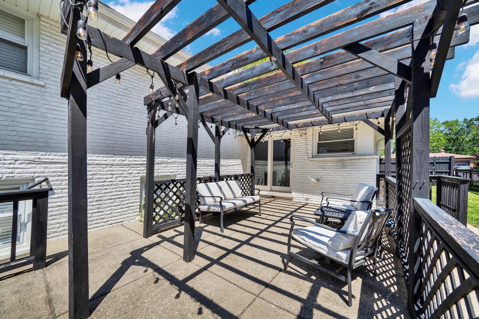 9737 West 57th Street Countryside, IL 60525 - Photo 18 of 19 a view of a patio with table and chairs and potted plants