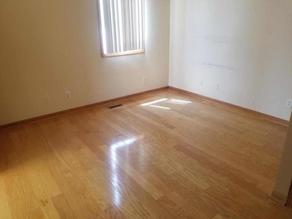 801 2nd Street LaSalle, IL 61301 - Photo 6 of 9 an empty room with wooden floor and windows