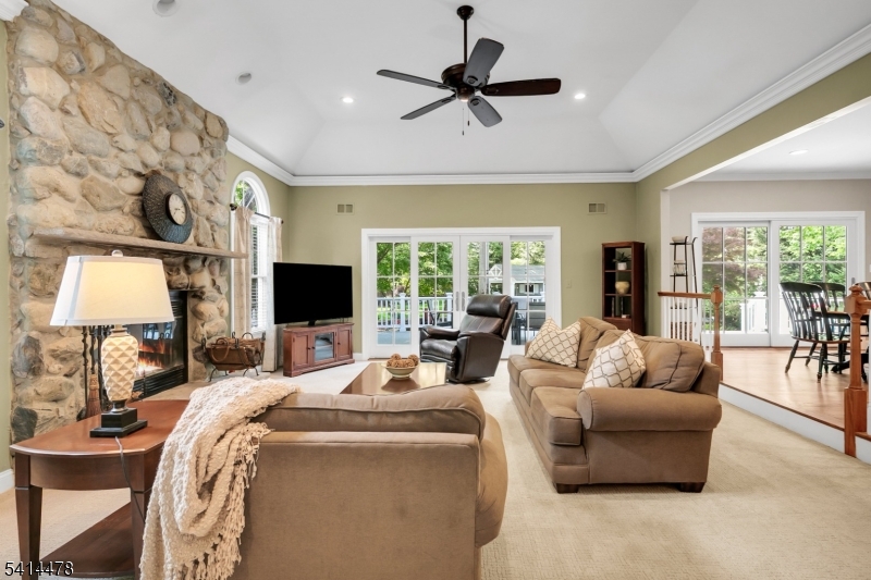 33 St Nickolas Way Bernards, NJ 07920 - Photo 9 of 50 a living room with furniture and a flat screen tv