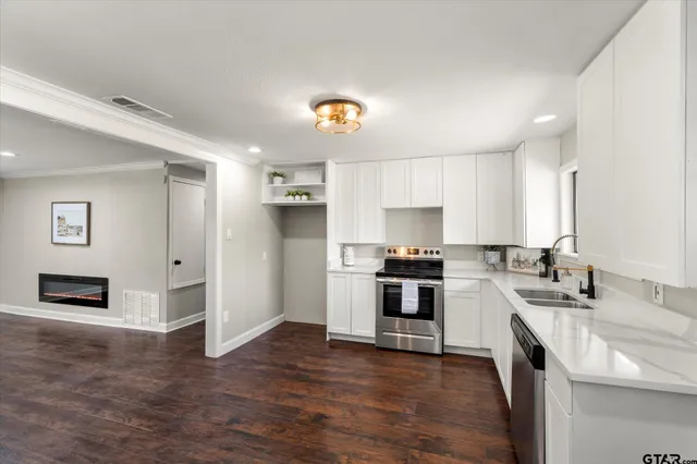 a kitchen with a sink stove and refrigerator