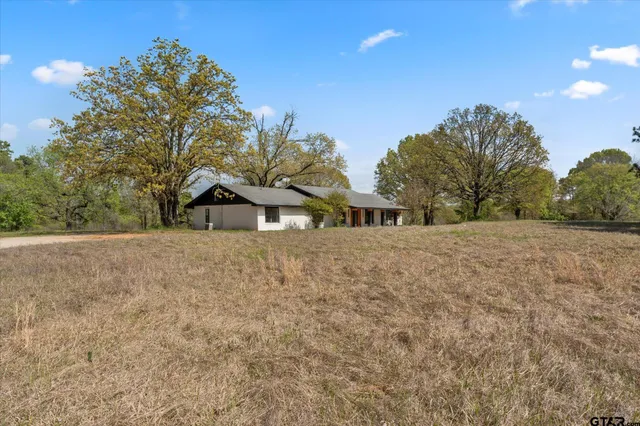 a view of house with outdoor space