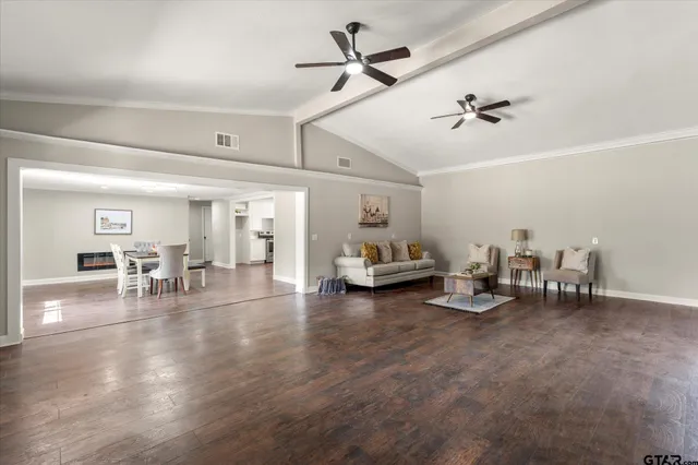 a living room with furniture and white walls