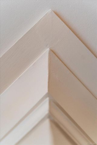 a spacious bedroom with a bed couch and a window