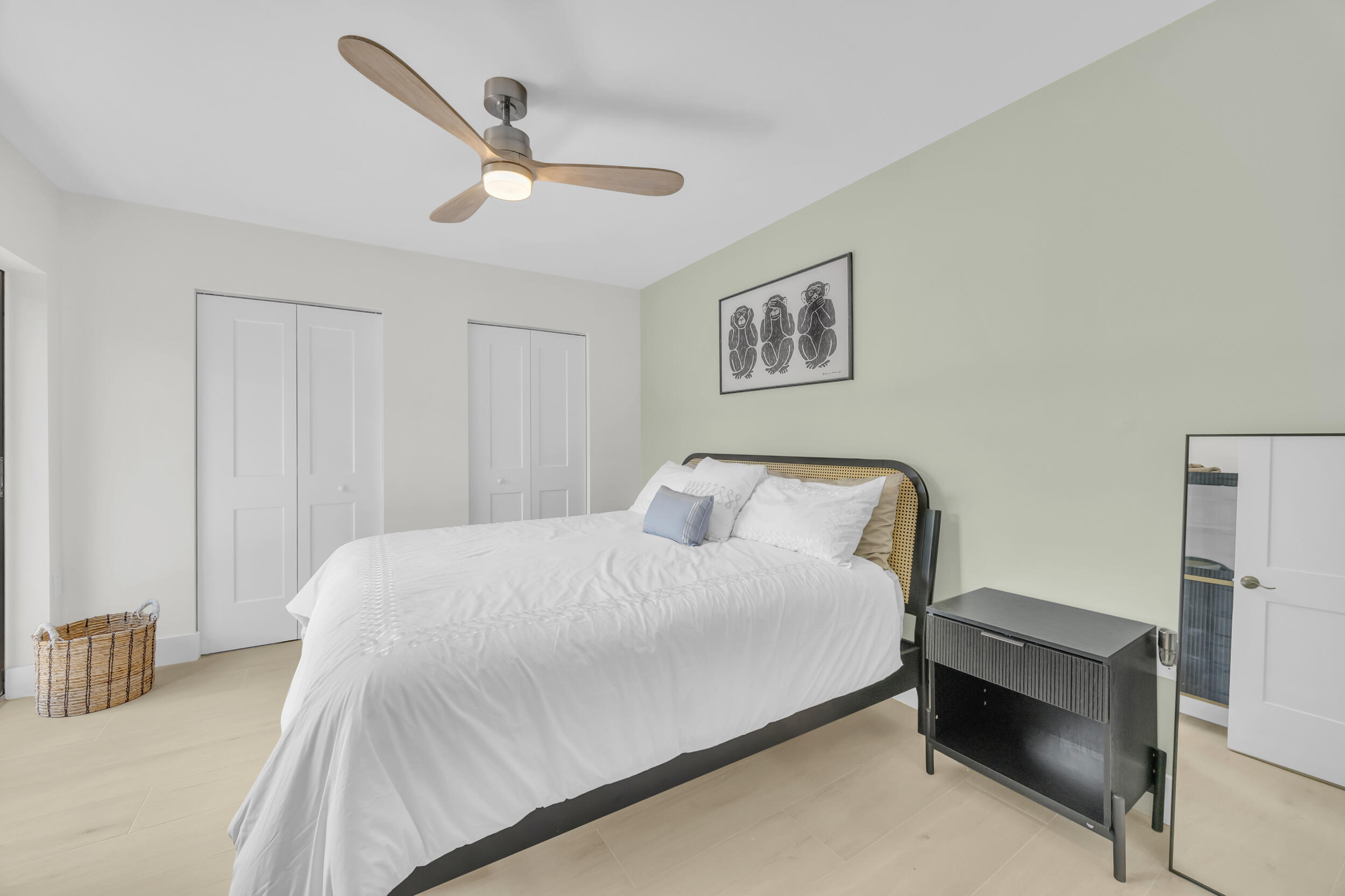 1208 12th Court Jupiter, FL 33477 - Photo 24 of 31 a bedroom with a bed and a cabinets