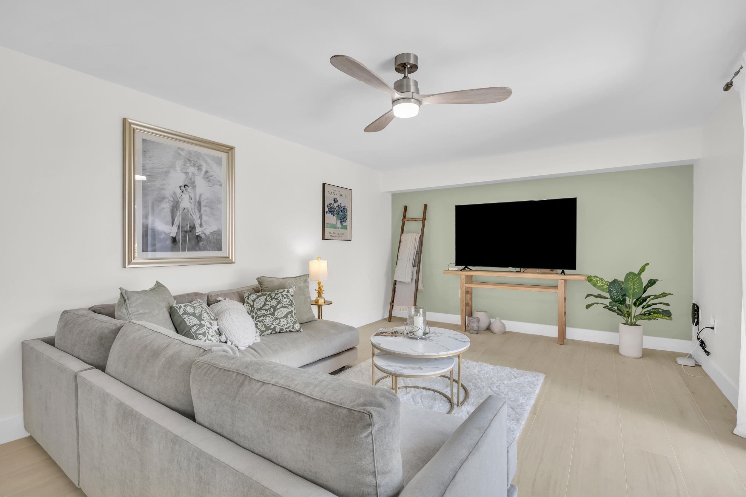 1208 12th Court Jupiter, FL 33477 - Photo 6 of 31 a living room with furniture and a flat screen tv