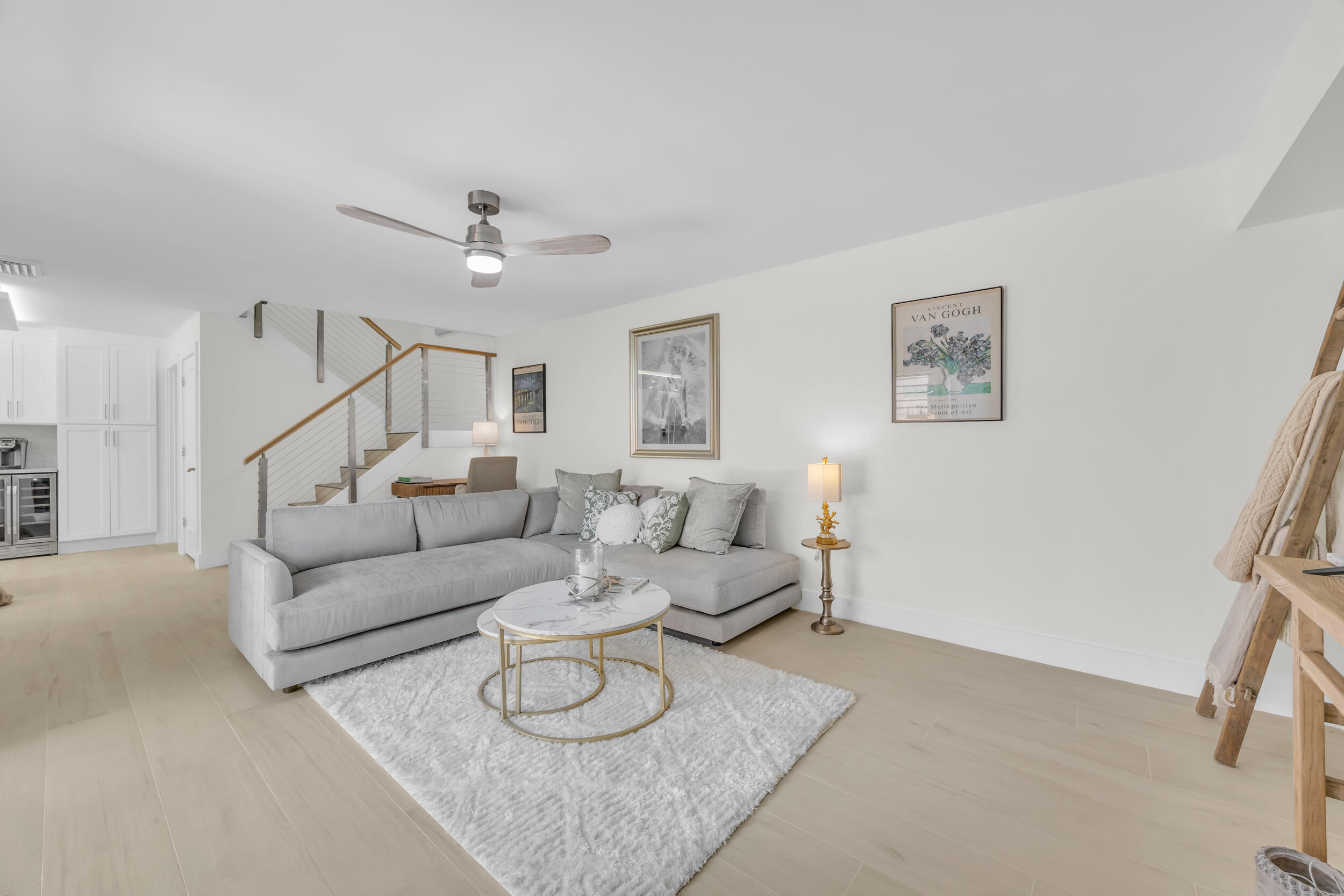 1208 12th Court Jupiter, FL 33477 - Photo 10 of 31 a living room with furniture and a ceiling fan