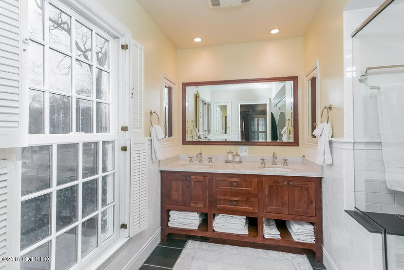 11 Wyngate Road Greenwich, CT 06830 - Photo 27 of 49 a bathroom with a sink mirror and a shower