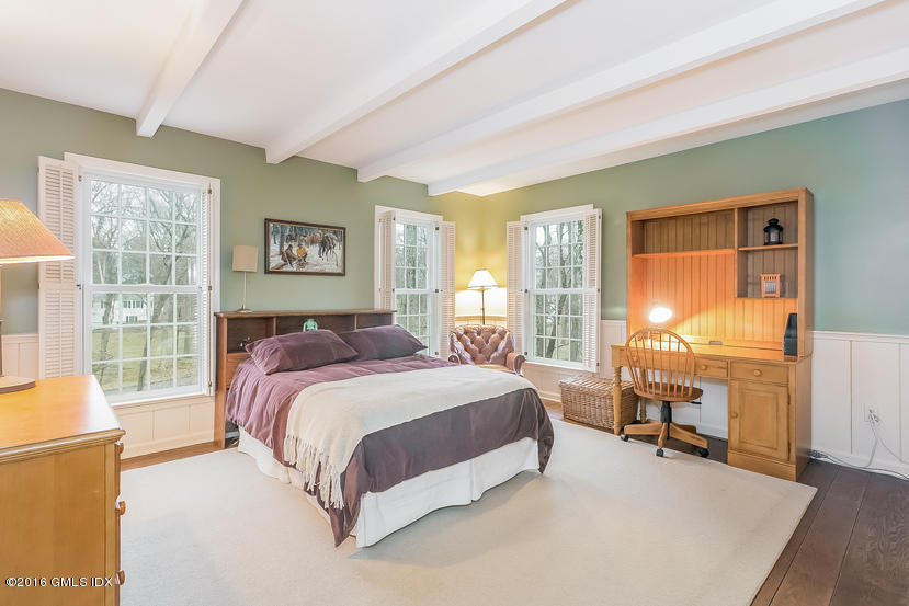 11 Wyngate Road Greenwich, CT 06830 - Photo 30 of 49 a spacious bedroom with a bed and a large window