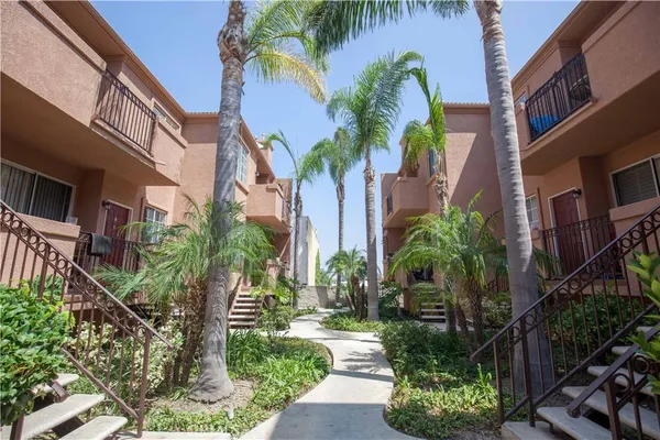 a view of a palm trees in front of a building
