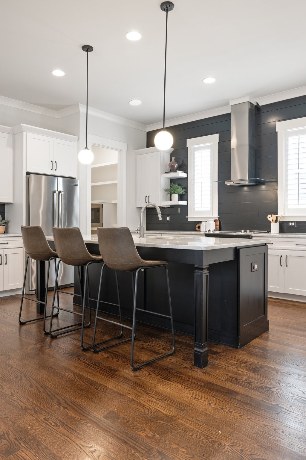 5543 Knob Road Nashville, TN 37209 - Photo 18 of 64 a kitchen with stainless steel appliances kitchen island granite countertop a stove a sink and a wooden floors