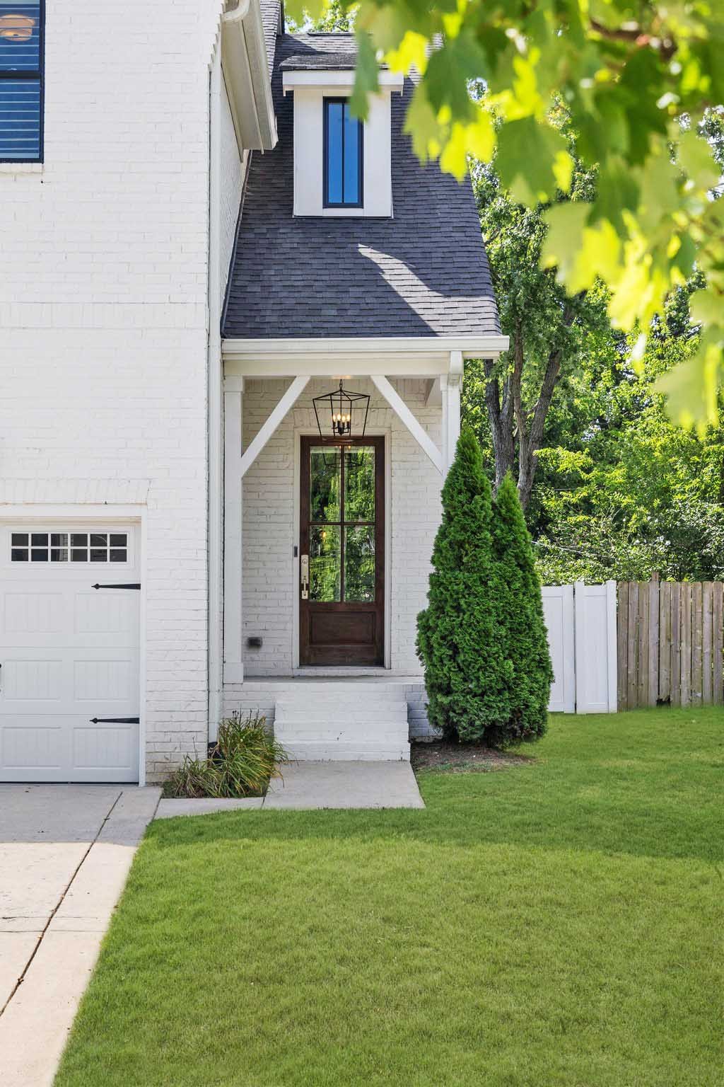 5543 Knob Road Nashville, TN 37209 - Photo 3 of 64 a front view of a house with garden