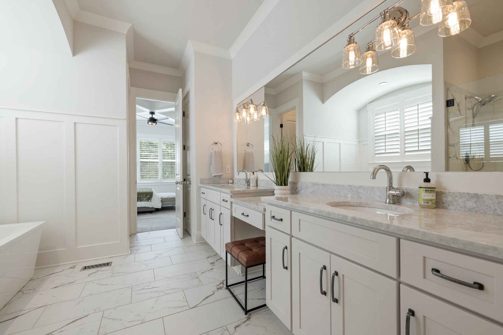 5543 Knob Road Nashville, TN 37209 - Photo 34 of 64 a spacious bathroom with a granite countertop sink a mirror and a