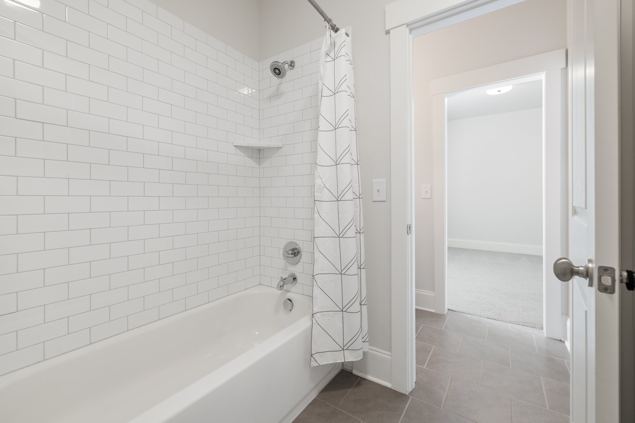 5543 Knob Road Nashville, TN 37209 - Photo 49 of 64 a bathroom with a bathtub and shower