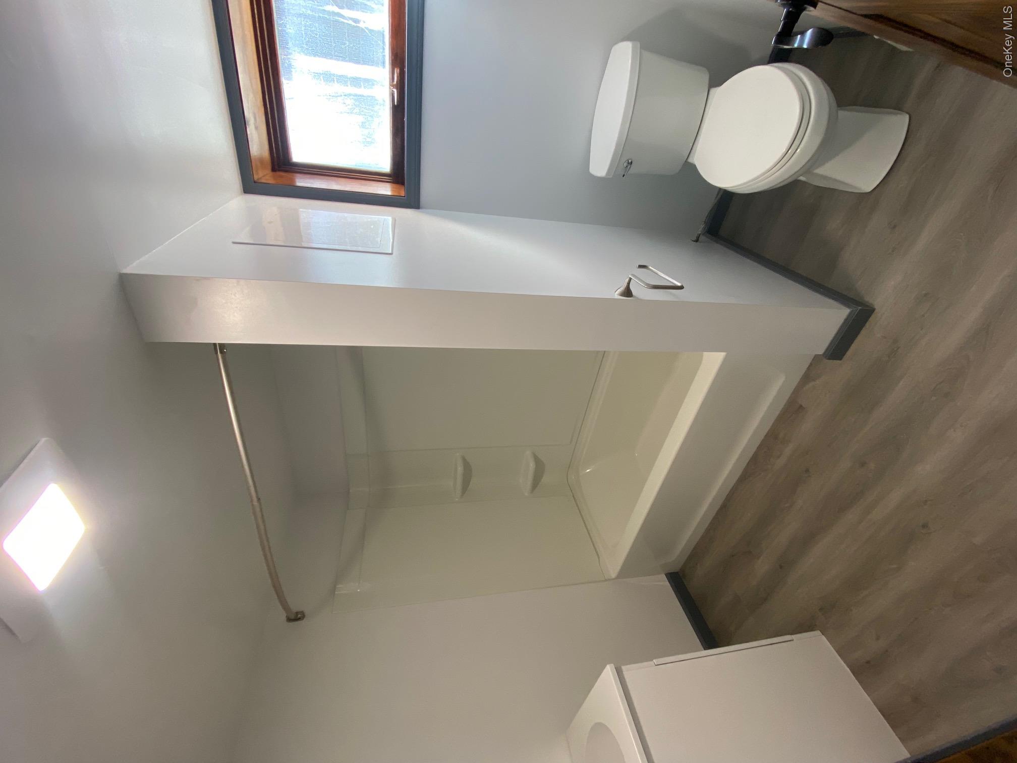 315 Upper Road, Unit LOWR Middletown, NY 10940 - Photo 8 of 9 Full bathroom with hardwood / wood-style flooring, vanity, toilet, and tub / shower combination